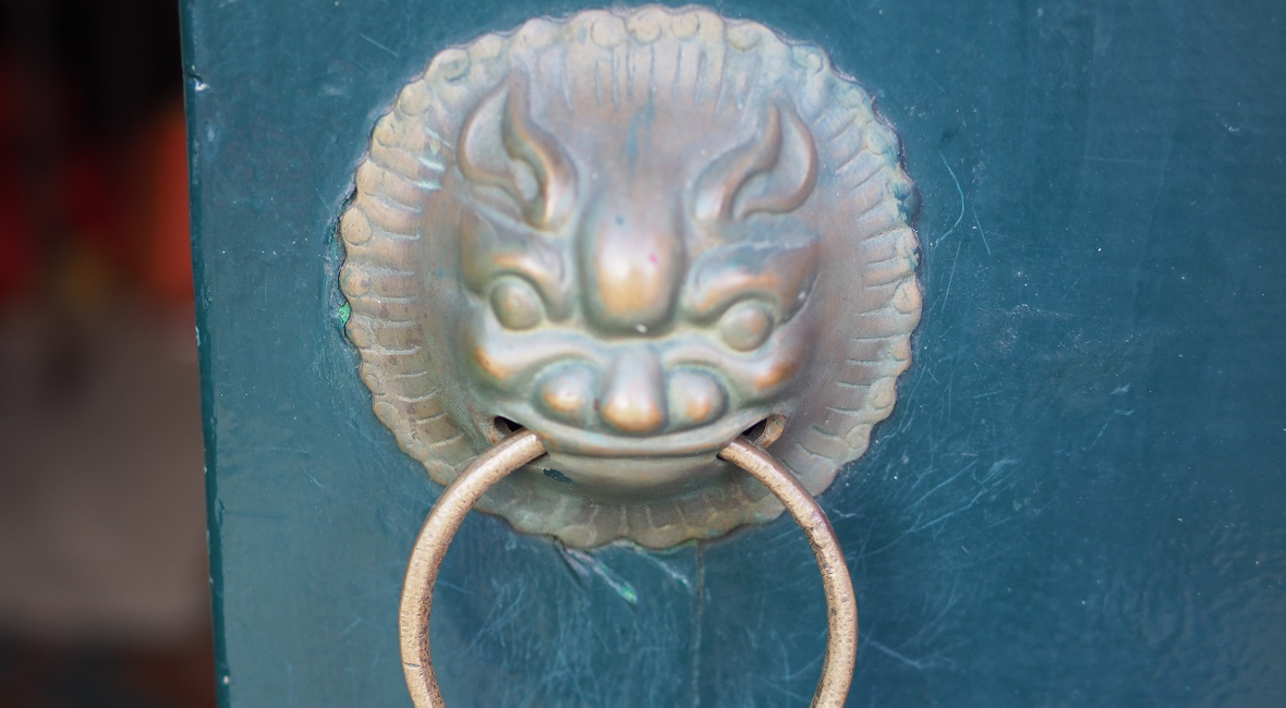 Close up of a dragon doorknob, Northbridge, WA