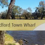 Guildford Town Wharf sign by the river near the bridge
