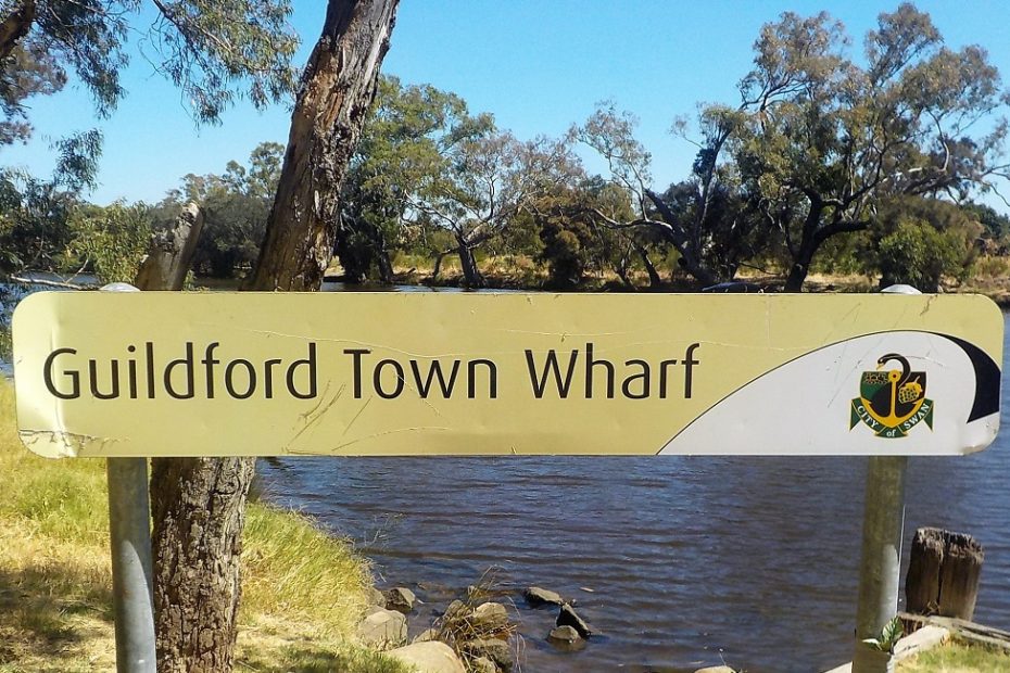 Guildford Town Wharf sign by the river near the bridge